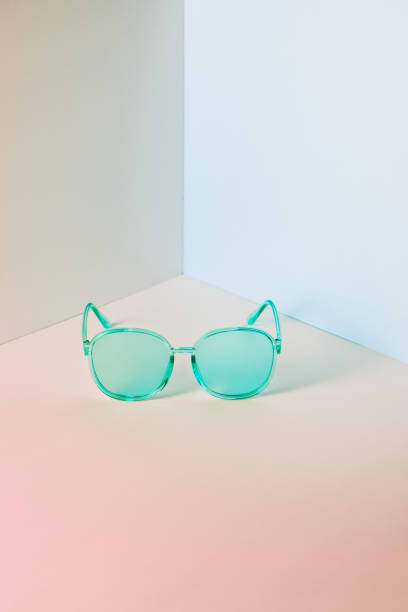 istock Stylish blue sunglasses on modern minimal pastel background, front view. Nobody. Product photograph 1257388902