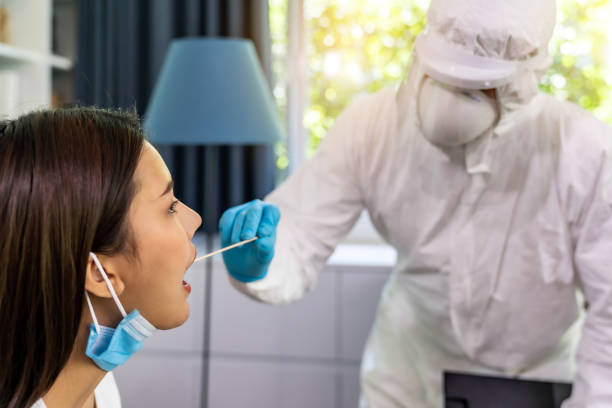 istock Medicla staff do COVID-19 testing at home 1257389341