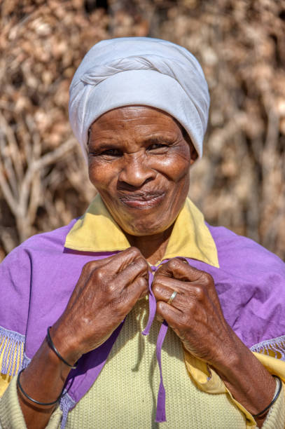 istock old african woman smiling 1257389356