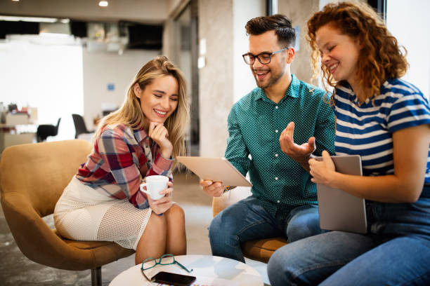 istock Happy creative team in office. Business, startup, design, people and teamwork concept 1257391719