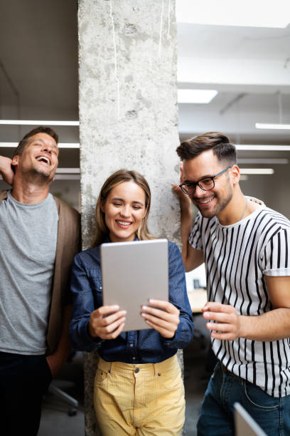 istock Business people brainstorming and chatting at workplace office 1257391938