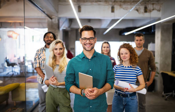 istock Group of successful business people designers architects in office 1257392155