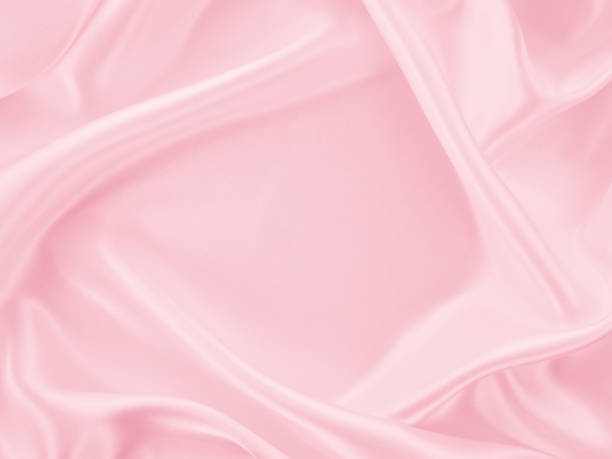 istock Beautiful elegant wavy light pink satin silk 1257392286