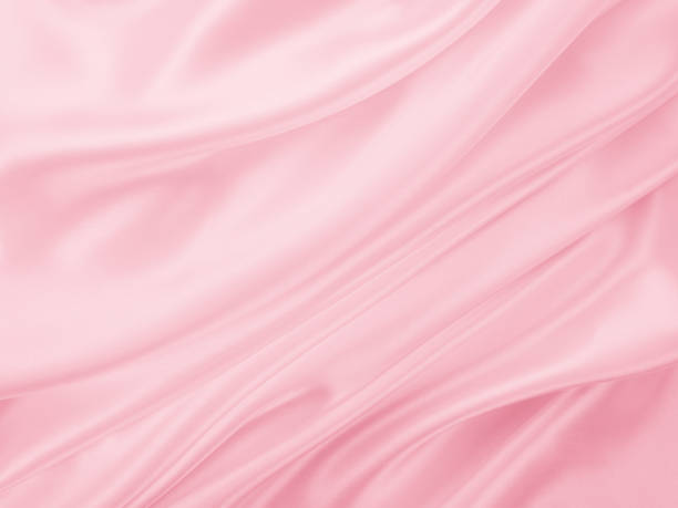 istock Beautiful elegant wavy light pink satin silk 1257392337