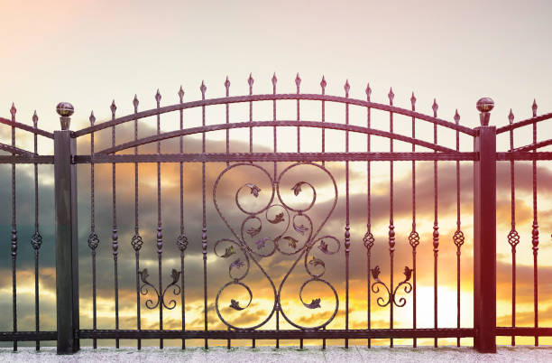 wrought iron fence wrought iron fence and sunset sky in background blacksmith shop photos stock pictures, royalty-free photos & images