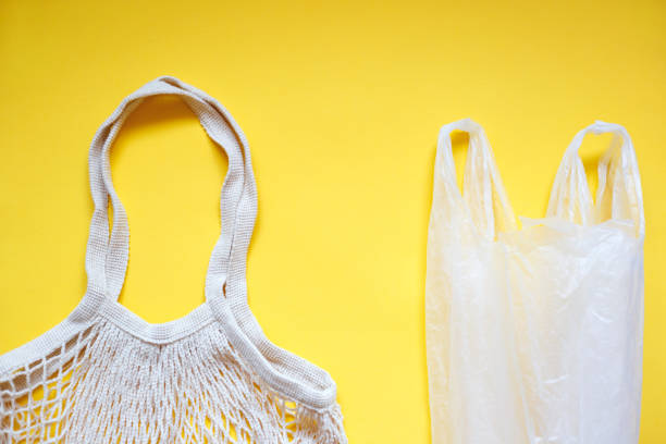 istock plastic bag with reusable tote bag for shopping on yellow background 1257394024