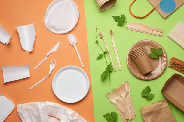 istock non-degradable plastic waste from disposable tableware and a set of dishes from environmental recycled materials on a green background 1257394954