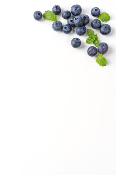 istock Blueberry fruit top view isolated on a white background, flat lay overhead layout with mint leaf. 1257396584