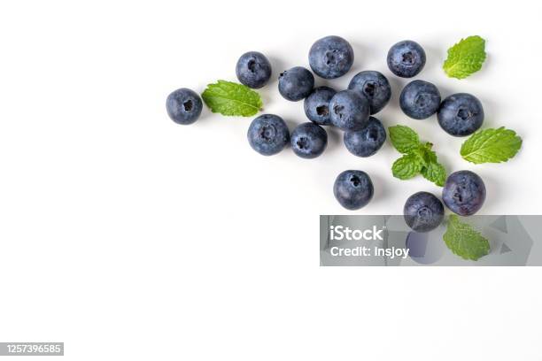 Blueberry Fruit Top View Isolated On A White Background Flat Lay Overhead Layout With Mint Leaf Stock Photo - Download Image Now