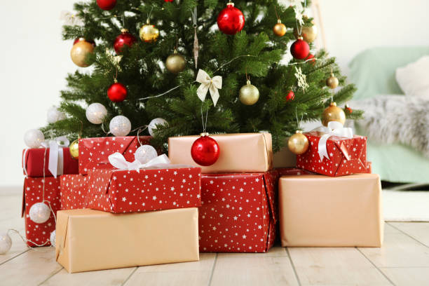 istock Many gifts under a festively decorated Christmas tree in a bright interior 1257399623
