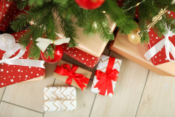 istock Many gifts under a festively decorated Christmas tree in a bright interior 1257399670