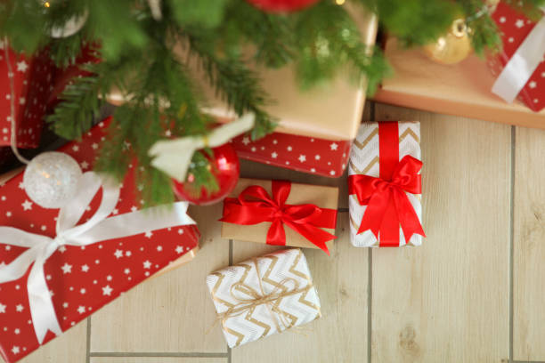 istock Many gifts under a festively decorated Christmas tree in a bright interior 1257399815