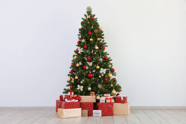 istock Many gifts under a festively decorated Christmas tree in a bright interior 1257399989