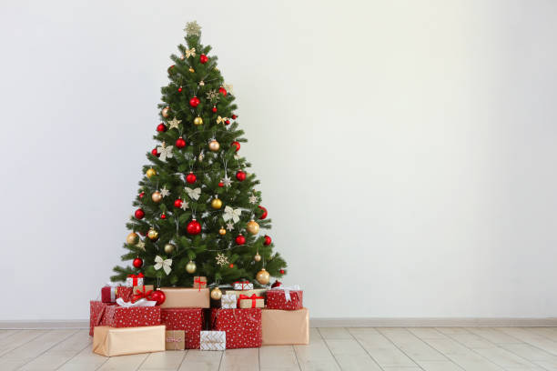 istock Many gifts under a festively decorated Christmas tree in a bright interior 1257400023