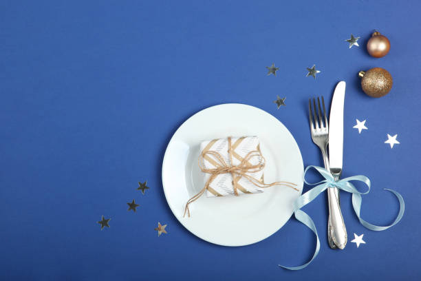 istock table setting for christmas or new year holiday top view. Mirimalism, place for text 1257400024