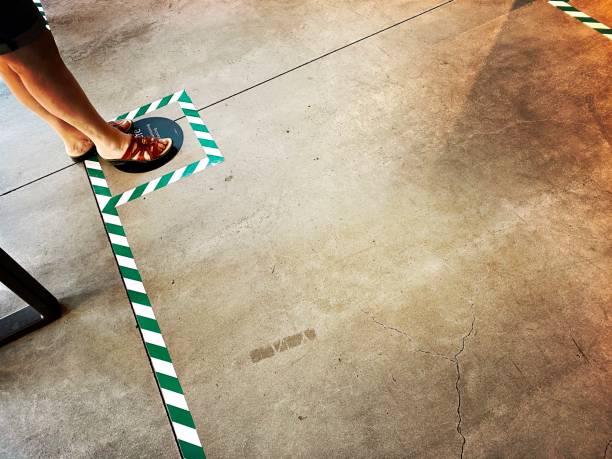 istock Social Distancing Signs in a Store 1257405292