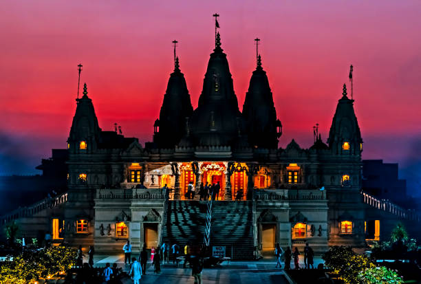 istock Silhouette image of Shree Swaminarayan temple on orange sky. 1257407162