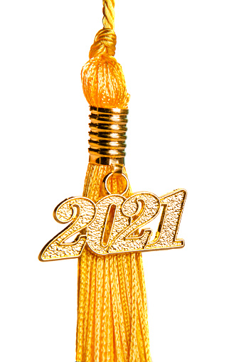 A close up of a 2021 charm on a tassel isolated on a white background.