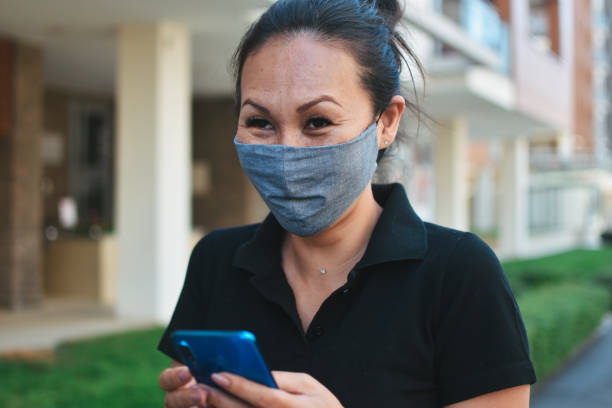 istock Woman with face protective mask 1257410352