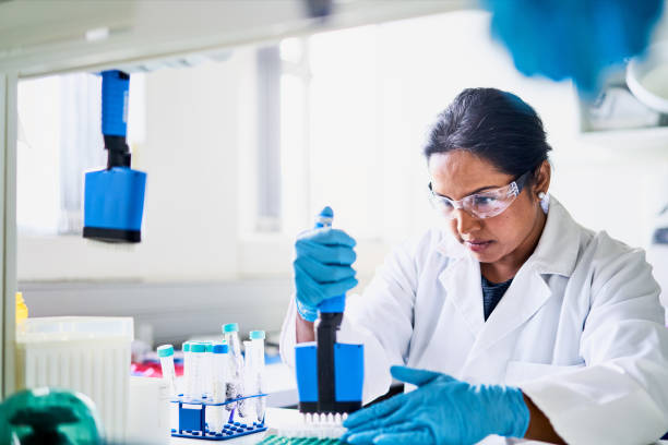istock Scientist extracting research samples with a pipette in a lab 1257411953