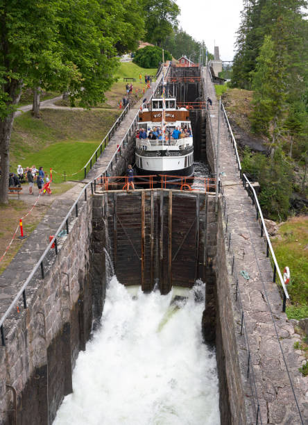 Telemark, Norway- July 10, 2020 Touristic boat with lots of tourists at Vrangfoss staircase locks