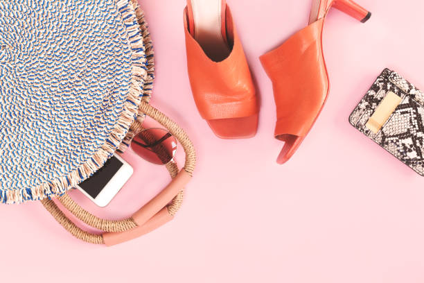 istock Summer straw bag and purse on pink background 1257413219