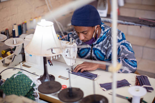 istock An African man making face masks in his fashion design studio. 1257414014