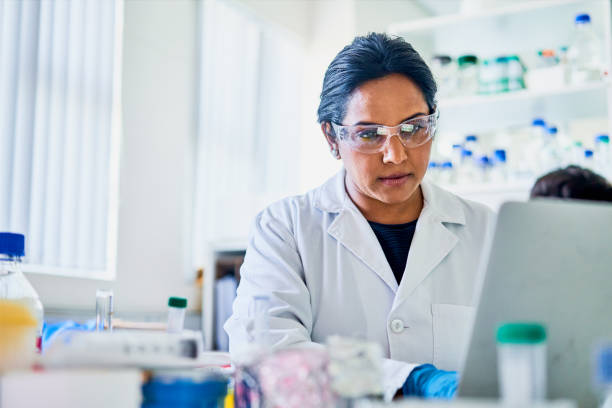 istock Scientist working on a laptop in a table in a lab 1257415123