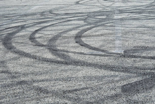 istock Asphalt with traces of tires 1257415773