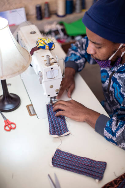 istock An African man making face masks in his fashion design studio. 1257416092
