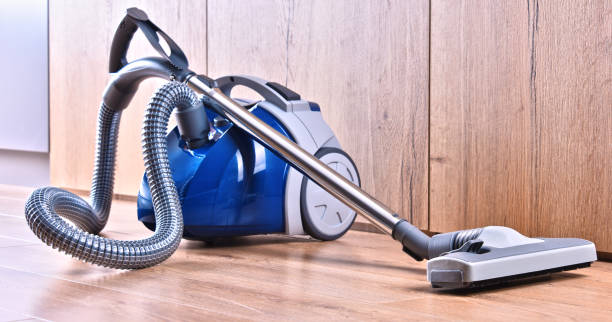 istock Canister vacuum cleaner for home use on the floor panels 1257416113