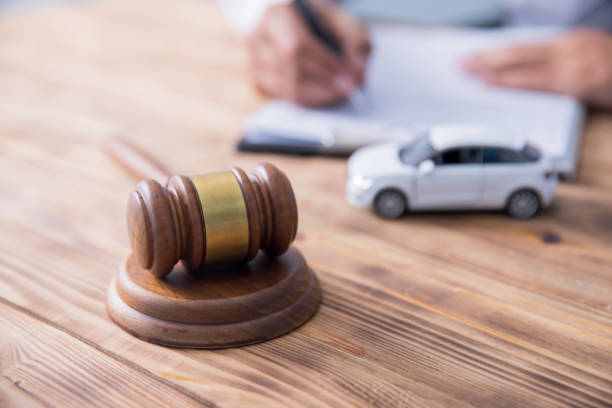 istock man with judge and car model 1257416384