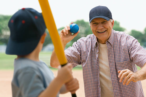 Grandfather and Grandson playing baseball West Newyork, NJ old baseball stock pictures, royalty-free photos & images