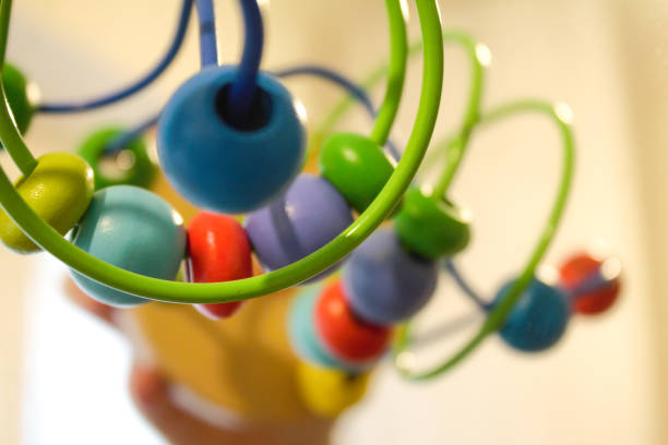 Wooden blocks of a bead roller coaster. Colourful wooden kid toy￼. Logic toy