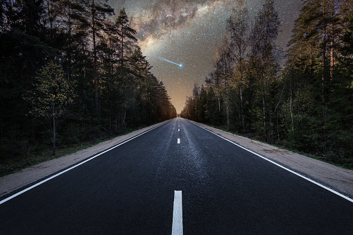 Road at night and milky way and starry sky