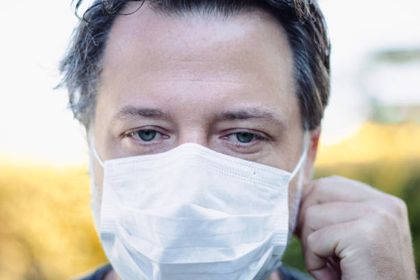 istock The man removes the protective mask on his face and relaxes. 1257418764
