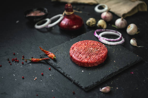 istock Minced beef burgers with spices and ingredients 1257419082