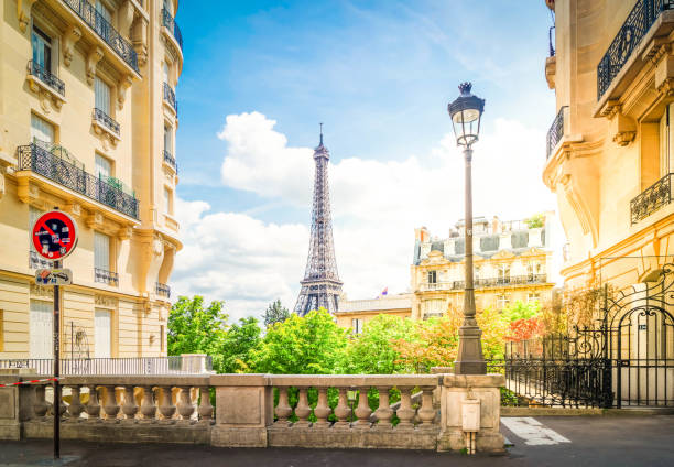 istock eiffel tour and Paris street 1257419819