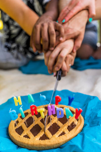 Young woman celebrating birthday on teleconference