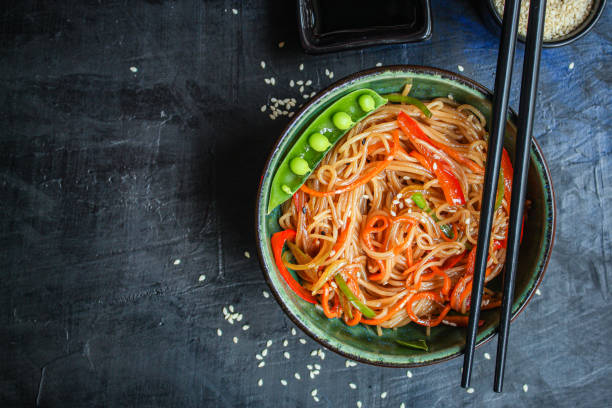 istock rice noodles with vegetables cellophane pasta food background top view copy space for text organic eating healthy 1257422432