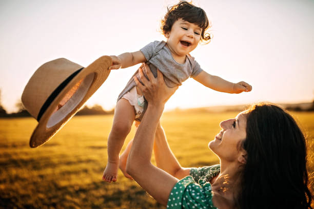 istock Mother and son in meadow 1257424736