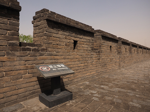A sign on the city wall in Pingyao, China on May 2019