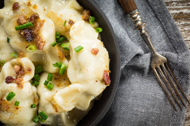 istock Fried dumplings (pierogi) with meat filling sprinkled with greaves. 1257426672