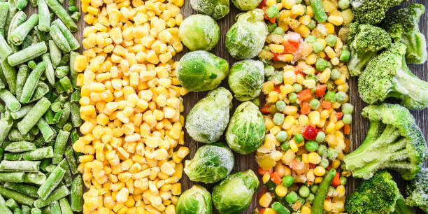 istock Different frozen vegetables as background, top view. Stocking up vegetables for winter storage. Assortment of frozen vegetables 1257428388
