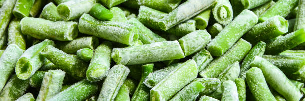istock frozen chopped green beans, flat lay, frozen vegetable background, texture, pattern, Stocking up vegetables for winter storage 1257428389