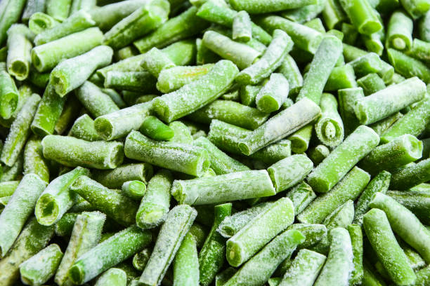 istock frozen chopped green beans, flat lay, frozen vegetable background, texture, pattern, Stocking up vegetables for winter storage 1257428403