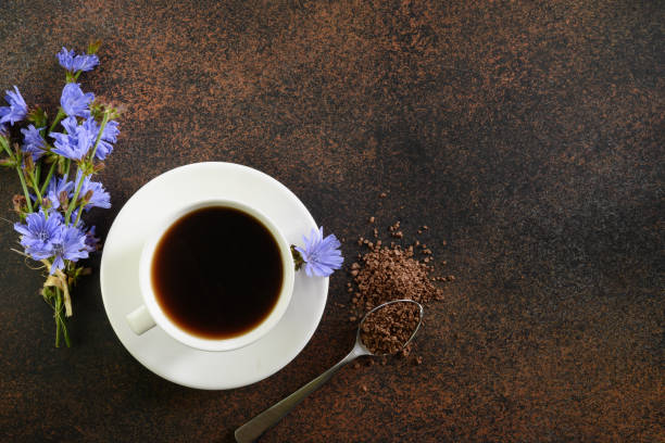 istock Chicory drink and flowers. Healthy herbal beverage, coffee substitute. Top view. 1257428411
