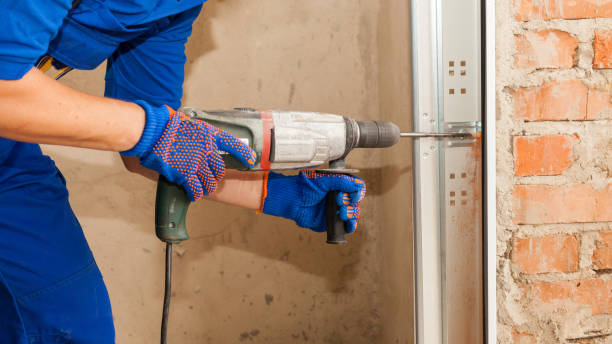 istock Professional worker install garage doors at new house 1257429525