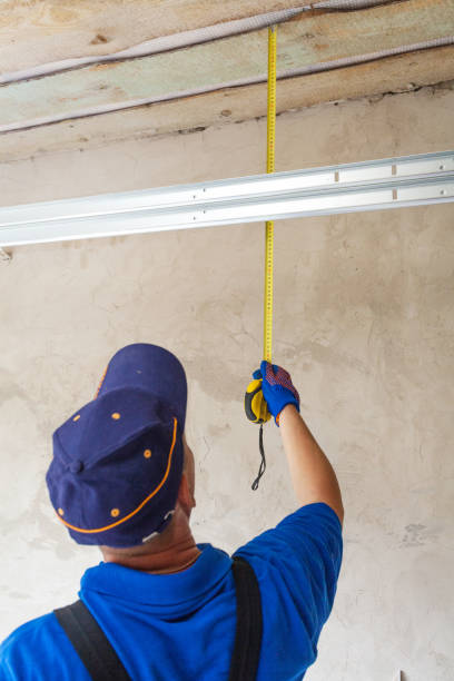 istock Professional worker install garage doors at new house 1257429532