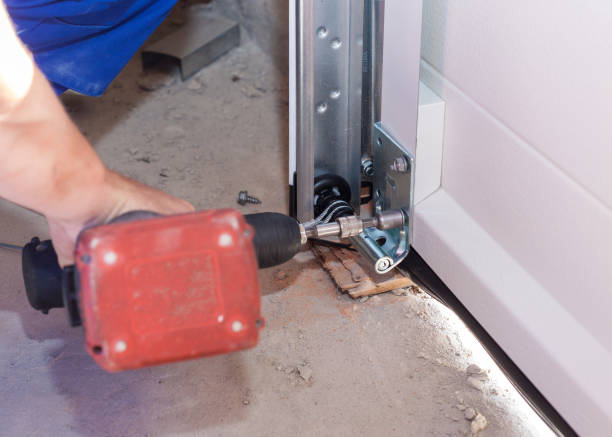 istock Professional worker install garage doors at new house 1257429549